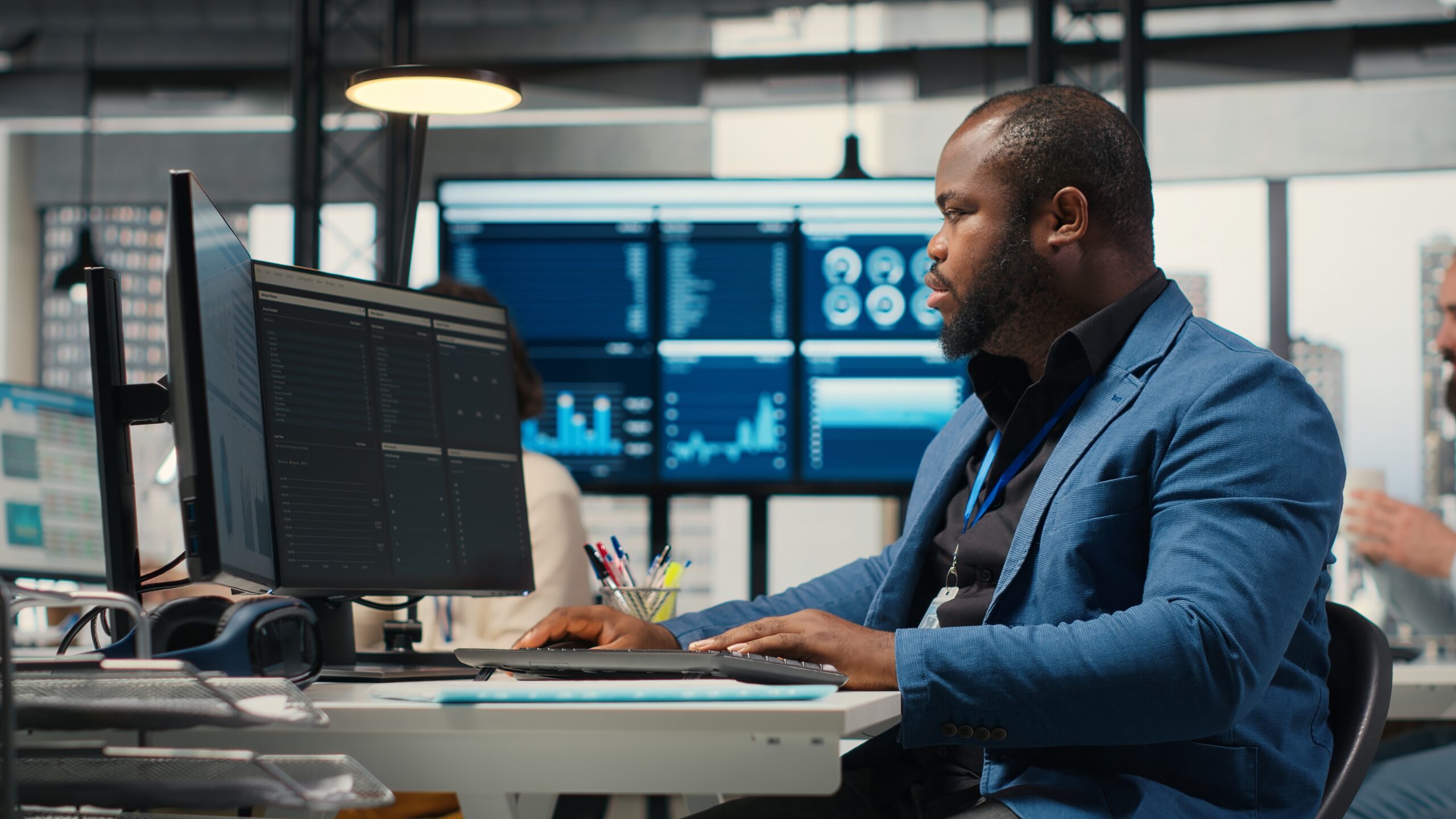 African american male analyzing financial data forecast on a computer, African american male analyzing financial data forecast on a computer,